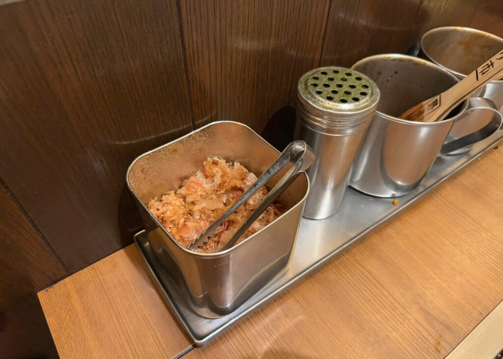 bonito flakes and aonori placed on the table