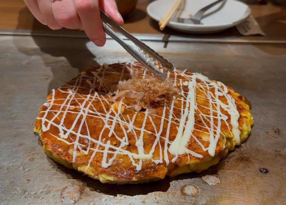 okonomiyaki topped with bonito flakes